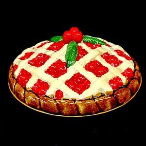 Vintage 11” hand painted cherry pie shaped ceramic lidded  “pie keeper”
